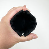 Squeeze pouch measuring approximately 5" tall x 4" wide. Outer fabric is a black and white floral print with Latin text of the Hail Mary dispersed throughout. Inside accent is a black fabric. Snap frame for easy opening and closing.