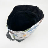 Bl. Pier Giorgi Frassati drawstring pouch; main exterior fabric is white background with Frassati images; black waxed canvas bottom; black lining