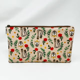 Basic zipper pouch measuring 9.25" wide by 5.25" tall. Exterior fabric features tan background multicolored floral print with images of the Brown Scapular.