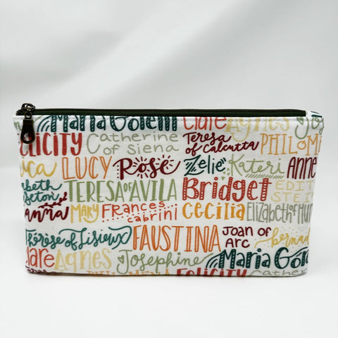 Basic zipper pouch measuring 9.25" wide by 5.25" tall. Exterior fabric features white background with female Saint names throughout. 